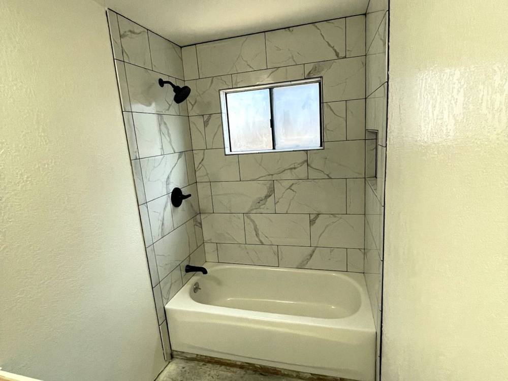 Tub surround, same house