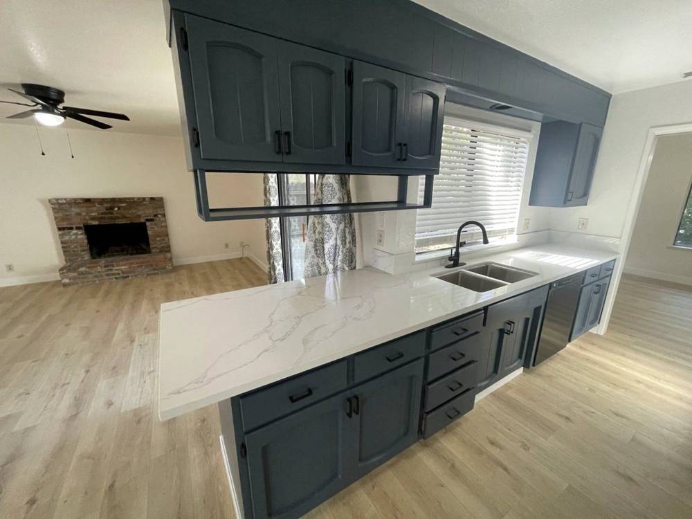 A finished living room and kitchen