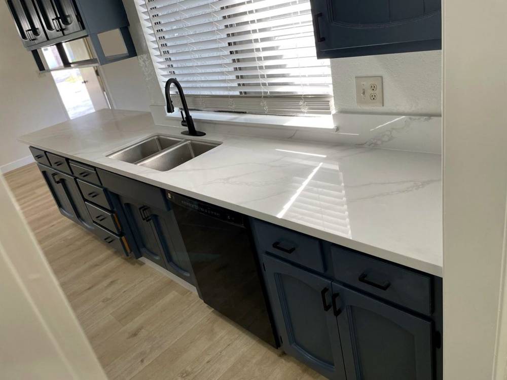 Refinished cabinets, quartz, new floors