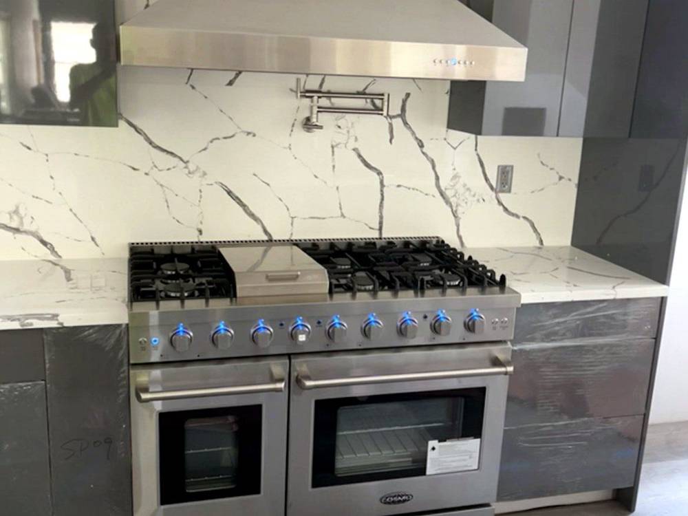 Marble kitchen, range and hood