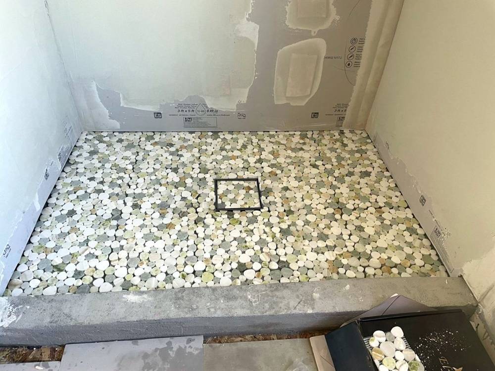 Pebble floor going in